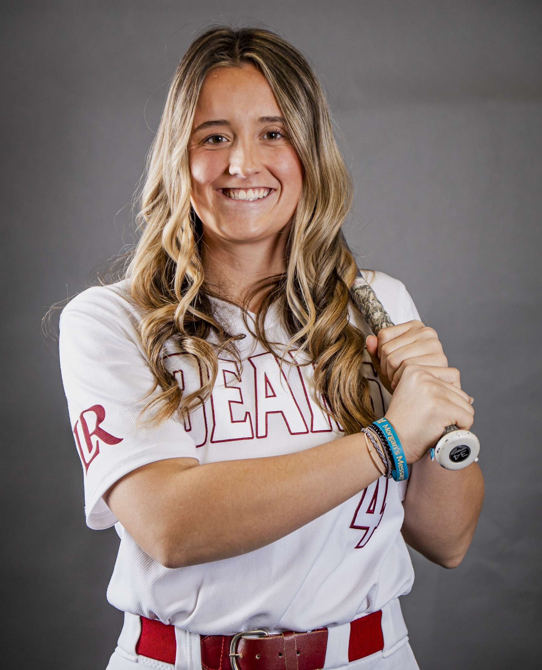 small girl holding a bat