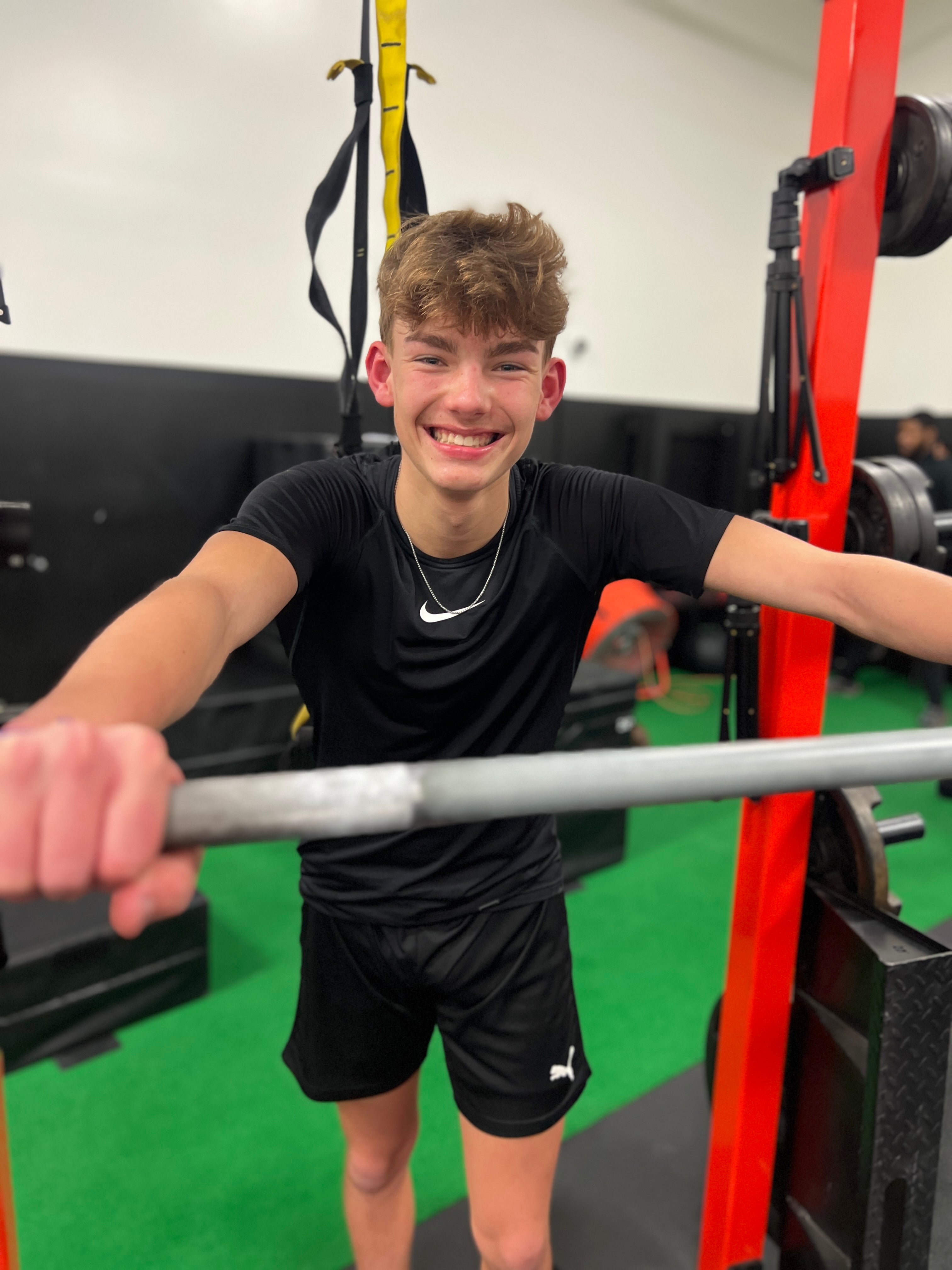 happy kid hold barbell